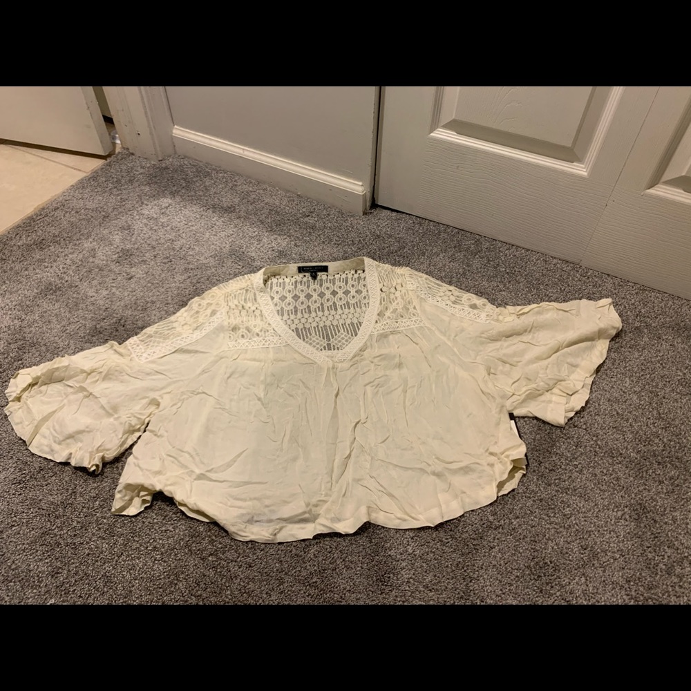 Cream size small lace float top